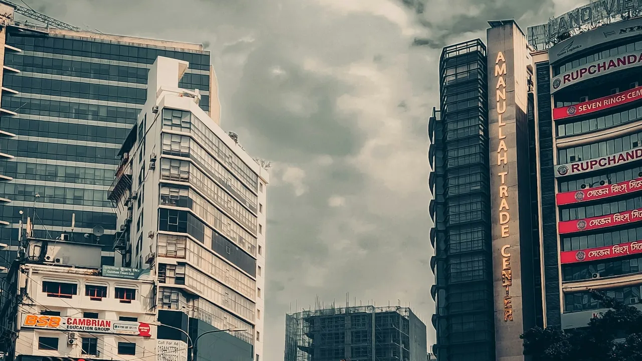 A Dhaka city street lined with tall buildings
