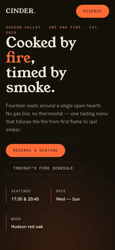 The CINDER restaurant website on a phone