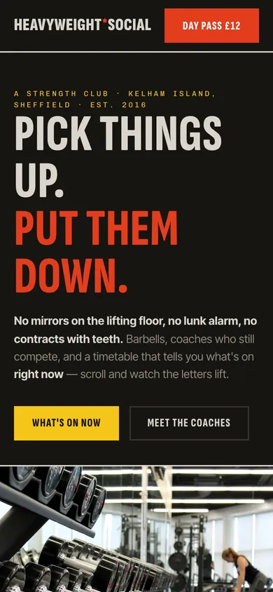 The HEAVYWEIGHT SOCIAL fitness website on a phone